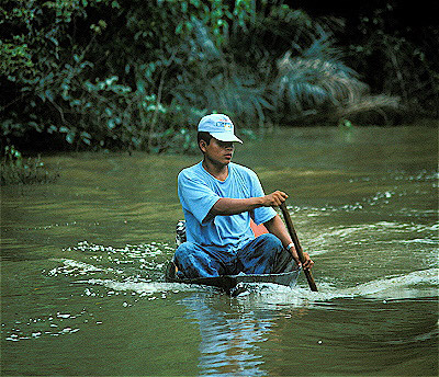 man in dugout canoe